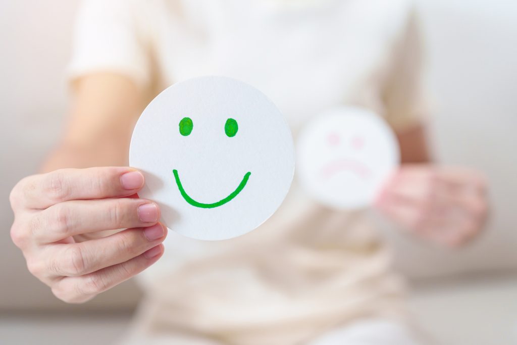 woman show happy smile face paper, mental health assessment, psy